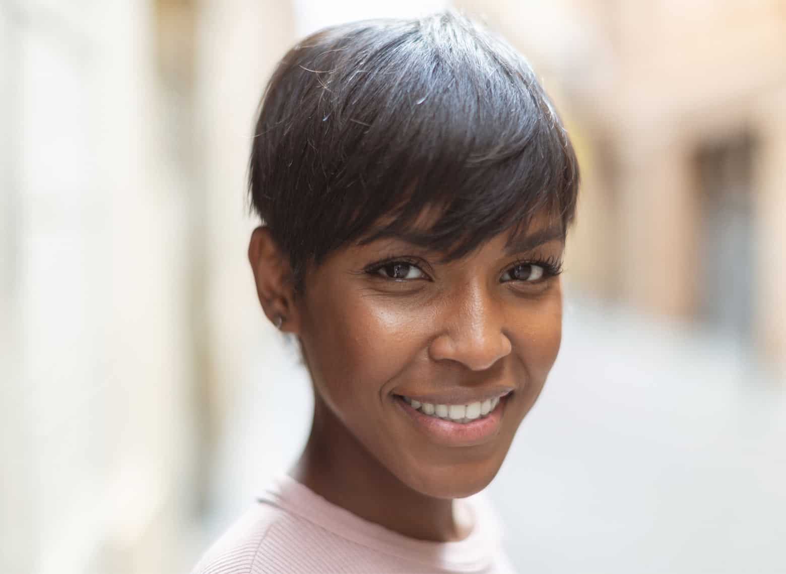 woman with pixie cut and long bangs