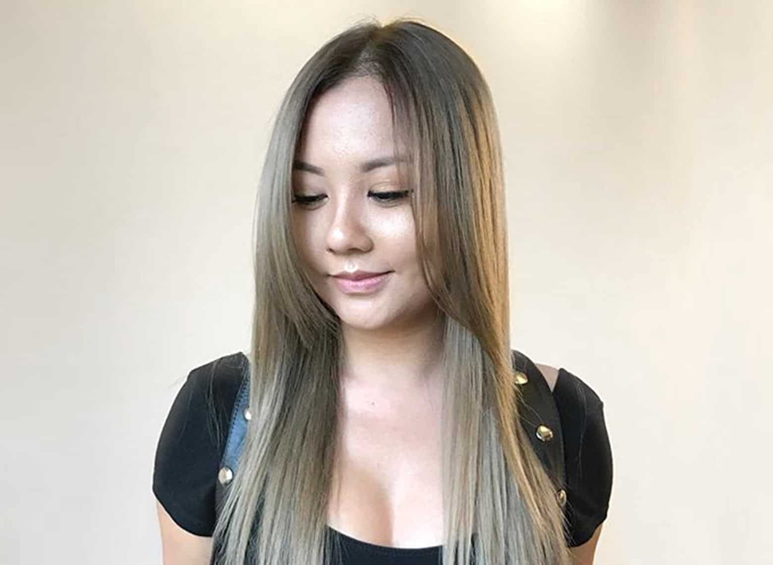 woman with straight hair and long bangs