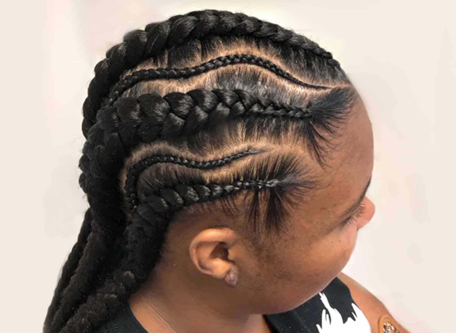 woman with feed in braids
